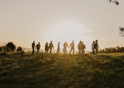 family walking with sunset background
